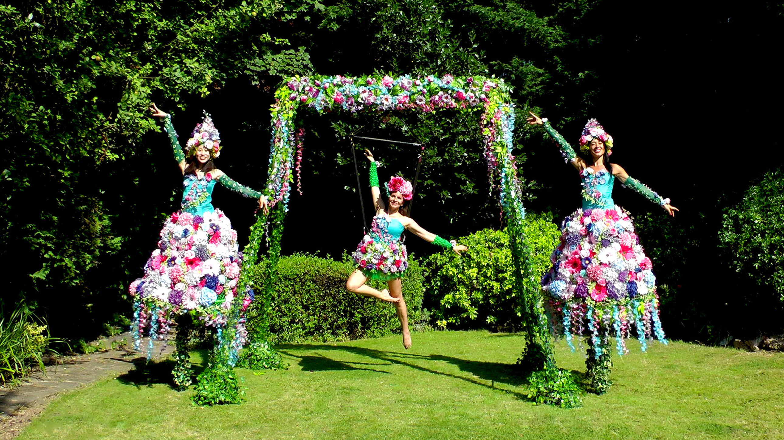 Floral garden aerial rig and matching floral stilt walkers promo